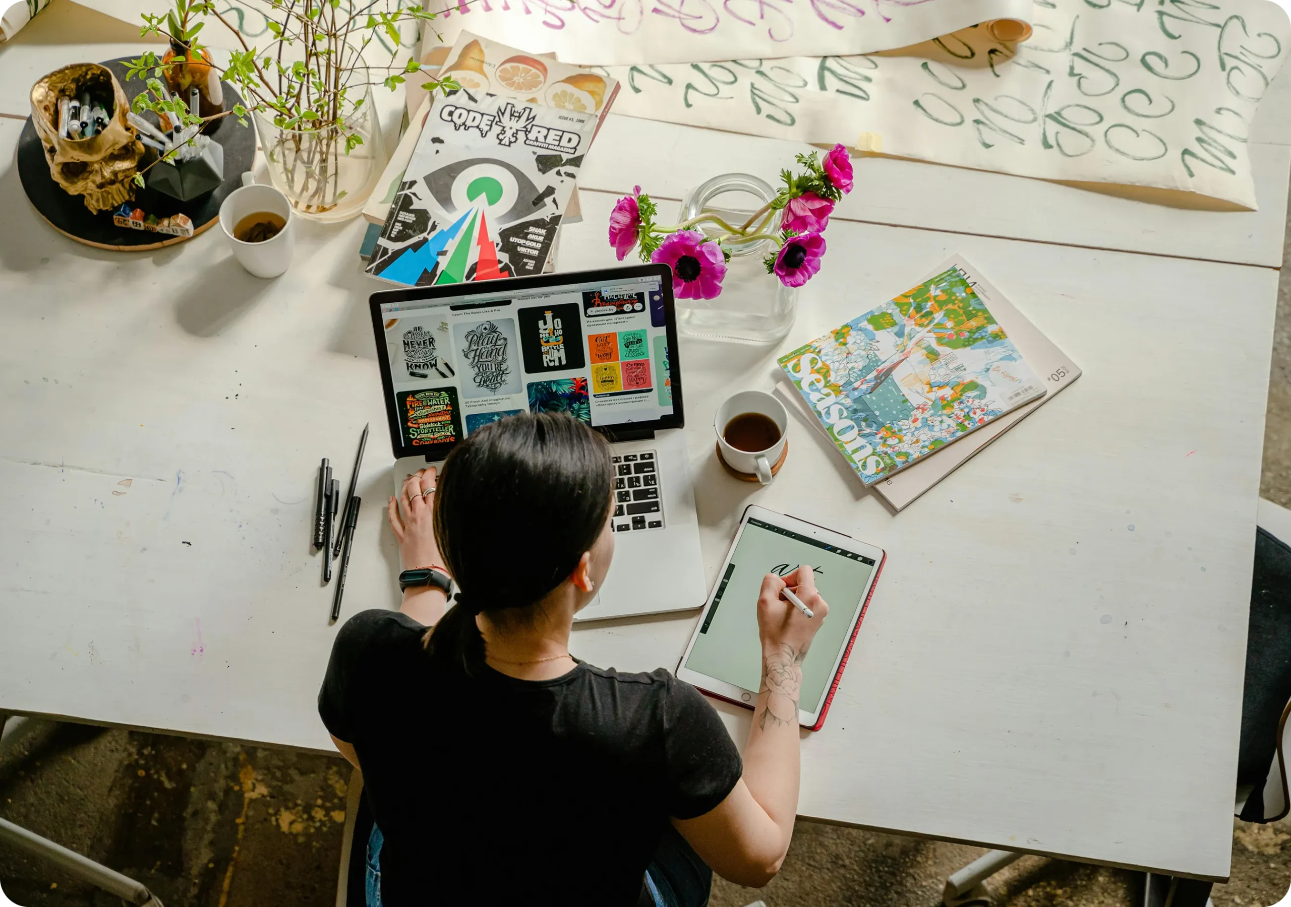 Managing Your Business Shouldn’t Feel Overwhelming An upper view of a person taking notes with a laptop in front